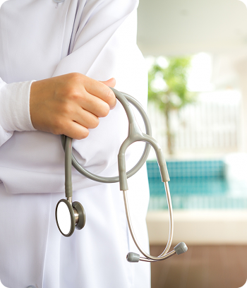 Doctor holding stethoscope at Al Shumoos Medical Centre